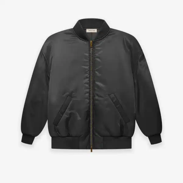 The Nylon Twill Bomber, featuring a black design with a gold zipper, front pockets, and ribbed cuffs and hem, is showcased against a white background.