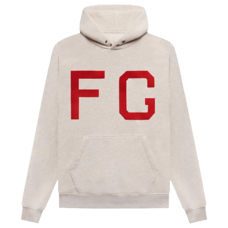 A 'Cream-Heather' Fear of God Essentials Hoodie featuring a front pocket, drawstring hood, and large red FG letters on the chest.